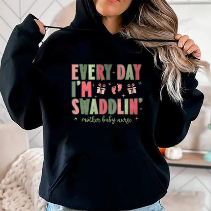Funny Nurse Shirt, Nurse Unisex T-Shirt/Hoodie/Sweatshirt HLT00 - Every Day I’m Swaddlin’ Nurse Christmas Mother Baby Nurse T-Shirt